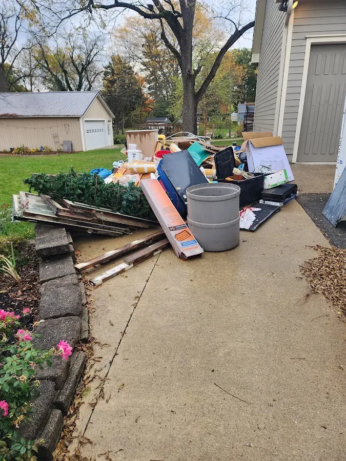 Dumpster being loaded with debris for 3 Yard Dumpster Rental in Limington